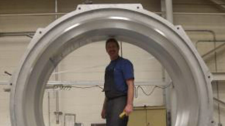 Paragon employee standing inside mold