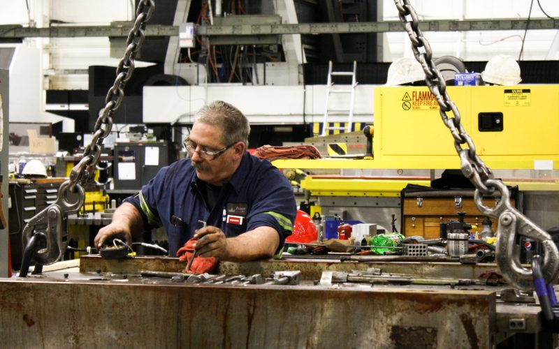 Paragon D&E machinist working on a machine tool repair